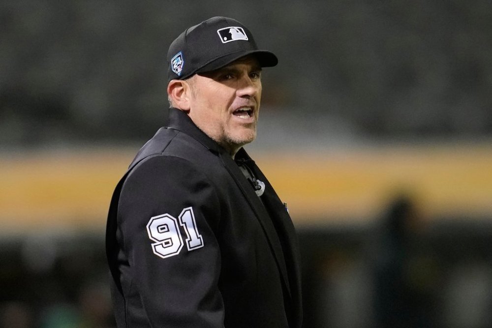 FILE - Umpire Brian Knight works during a spring training baseball game between the Oakland Athletics and the San Francisco Giants in Oakland, Calif., Monday, March 25, 2024. (AP Photo/Jeff Chiu, File)