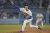 Los Angeles Dodgers pitcher Shohei Ohtani throws against the Minnesota Twins during the third inning of a baseball game in Los Angeles, Monday, July 21, 2025. (AP Photo/Jayne Kamin-Oncea)