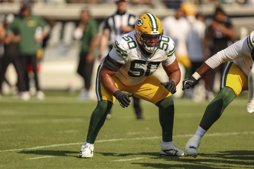 FILRE - Green Bay Packers guard Zach Tom (50) reacts at the snap during an NFL football game against the Jacksonville Jaguars, Sunday, Oct. 27, 2024, in Jacksonville, Fla. (AP Photo/Gary McCullough, File)
