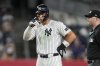 New York Yankees' Aaron Judge (99) reacts after hitting a single during the sixth inning of a baseball game against the Seattle Mariners, Tuesday, July 8, 2025, in New York. (AP Photo/Yuki Iwamura)
