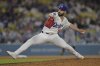Los Angeles Dodgers relief pitcher Tanner Scott delivers to the plate during the ninth inning of a baseball game, against the Minnesota Twins, Monday, July 21, 2025, in Los Angeles. (AP Photo/Jayne Kamin-Oncea)
