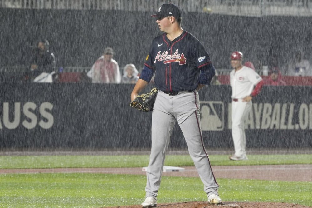 Atlanta Braves pitcher Austin Cox throws against the Cincinnati Reds during the first inning of the MLB Speedway Classic baseball game at Bristol Motor Speedway in Bristol, Tenn., Saturday, Aug. 2, 2025. (AP Photo/Chris Carlson)