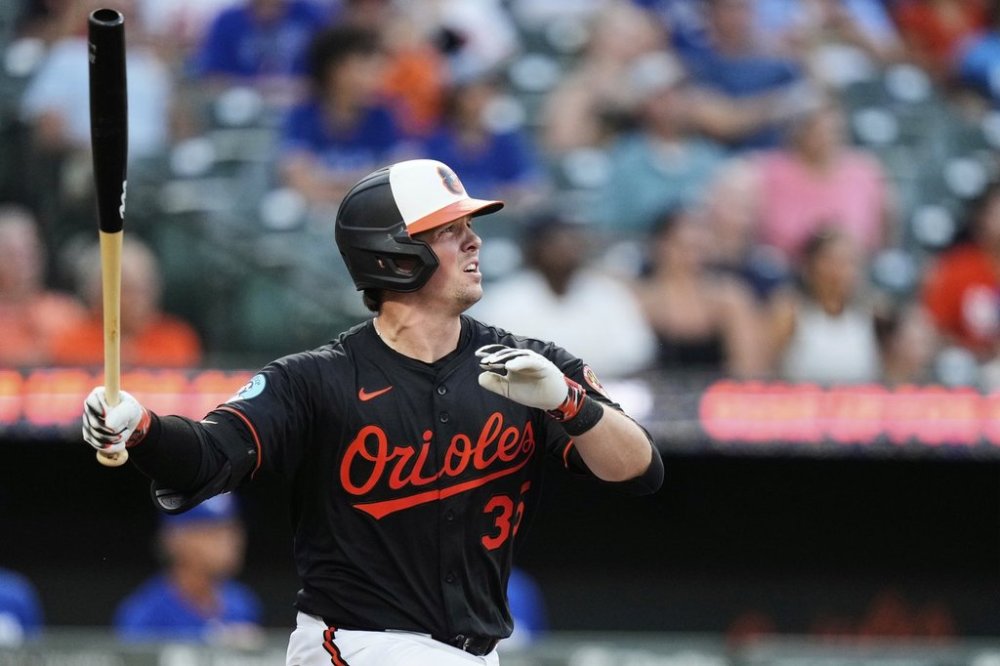 Baltimore Orioles' Adley Rutschman watches his two-run RBI double during the third inning of a baseball game against the Toronto Blue Jays, Monday, July 28, 2025, in Baltimore. (AP Photo/Stephanie Scarbrough)