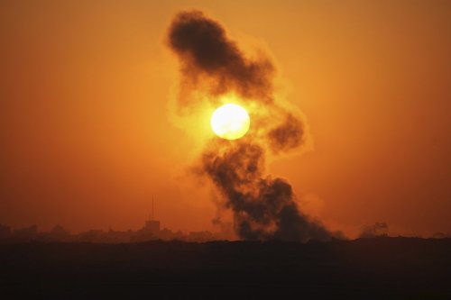 Smoke billows from an explosion in the northern Gaza Strip, as seen from southern Israel Wednesday, July 23, 2025. (AP Photo/Ohad Zwigenberg)