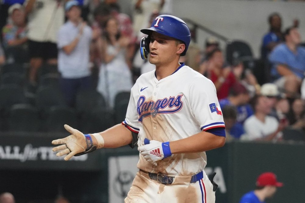 Texas Rangers' Corey Seager runs home after hitting a home run during the seventh inning of a baseball game against the Athletics, Tuesday, July 22, 2025, in Arlington, Texas. (AP Photo/LM Otero)
