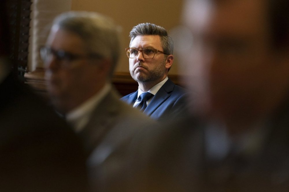 FILE - Covenant School parent Brent Leatherwood, center, listens during a status hearing in Chancellor I'Ashea L. Myles' courtroom involving the release of records related to the the March school shooting, May 22, 2023, in Nashville, Tenn. (AP Photo/George Walker IV, File)