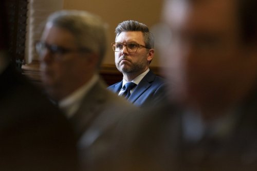 FILE - Covenant School parent Brent Leatherwood, center, listens during a status hearing in Chancellor I'Ashea L. Myles' courtroom involving the release of records related to the the March school shooting, May 22, 2023, in Nashville, Tenn. (AP Photo/George Walker IV, File)