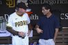 San Diego Padres manager Mike Shildt, left, and general manager A.J. Preller talk in the dugout before a baseball game against the Arizona Diamondbacks, Tuesday, July 8, 2025, in San Diego. (AP Photo/Orlando Ramirez)