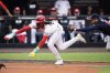 Cincinnati Reds' Elly De La Cruz is tagged out by Atlanta Braves third base Austin Riley during the first inning of the MLB Speedway Classic baseball game at Bristol Motor Speedway in Bristol, Tenn., Sunday, Aug. 3, 2025. Play was resumed today after yesterday's weather delay. (AP Photo/George Walker IV)