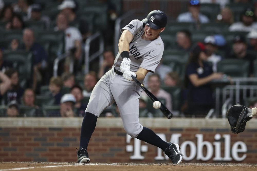 New York Yankees' Ben Rice hits a double in the eighth inning of a baseball game against the Atlanta Braves, Friday, July 18, 2025, in Atlanta. (AP Photo/Colin Hubbard)