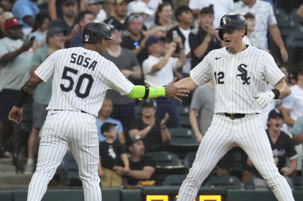 Chicago White Sox's Colson Montgomery, right, celebrates with Lenyn Sosa after hitting a two-run home run during the third inning of a baseball game against the Philadelphia Phillies in Chicago, Monday, July 28, 2025. (AP Photo/Nam Y. Huh)