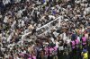 FILE - Fans of PSG invade the pitch after the Champions League final soccer match between Paris Saint-Germain and Inter Milan at the Allianz Arena in Munich, Germany, Saturday, May 31, 2025. (AP Photo/Michael Probst, File)