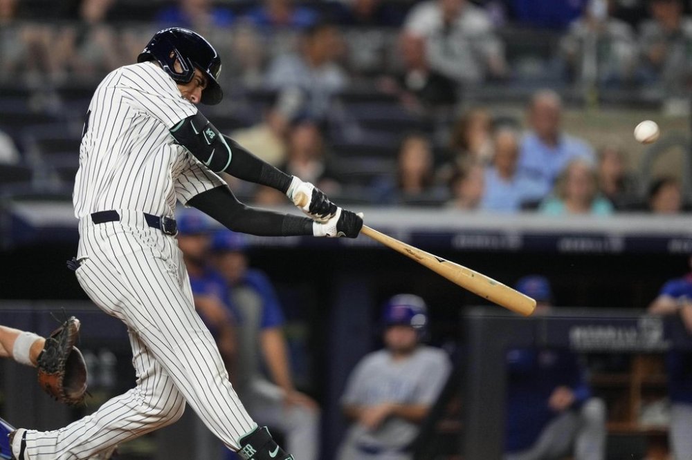 New York Yankees' Cody Bellinger hits a home run during the eighth inning of a baseball game against the Chicago Cubs, Friday, July 11, 2025, in New York. (AP Photo/Yuki Iwamura)