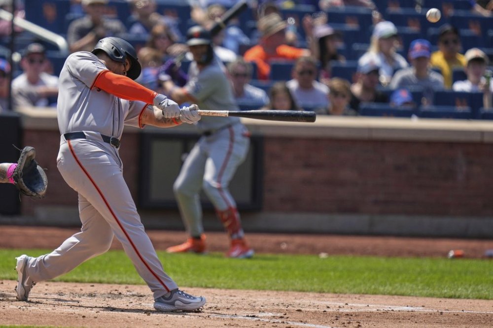 San Francisco Giants' Rafael Devers hits a three-run homer during the third inning of a baseball game against the New York Mets, Sunday, Aug. 3, 2025, in New York. (AP Photo/Seth Wenig)