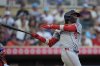 Washington Nationals' CJ Abrams hits a two-run double during the fifth inning of a baseball game against the Minnesota Twins, Saturday, July 26, 2025, in Minneapolis. (AP Photo/Abbie Parr)