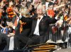 FILE - San Francisco Giants owner Bill Neukom celebrates while riding in a car during a baseball World Series parade in downtown San Francisco, Nov. 3, 2010. (AP Photo/Paul Sakuma, File)
