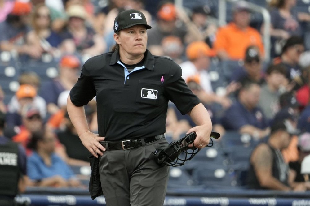 FILE - Home plate umpire Jen Pawol takes her position during the first inning of a spring training baseball game between the Houston Astros and Miami Marlins Sunday, March 10, 2024, in West Palm Beach, Fla. (AP Photo/Jeff Roberson, File)
