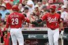 Cincinnati Reds' Spencer Steer, right, congratulates teammate TJ Friedl on scoring a run against the Colorado Rockies during the third inning of a baseball game, Sunday, July 13, 2025, in Cincinnati. (AP Photo/Jay LaPrete)