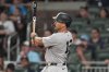New York Yankees' Trent Grisham (12) hits a grand slam home run against the Atlanta Braves in the ninth inning of a baseball game, Saturday, July 19, 2025, in Atlanta. (AP Photo/Mike Stewart)