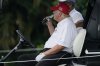 FILE - Former President Donald Trump drinks a Diet Coke during the ProAm of the LIV Golf Team Championship at Trump National Doral Golf Club, Oct. 27, 2022, in Doral, Fla. (AP Photo/Lynne Sladky, File)