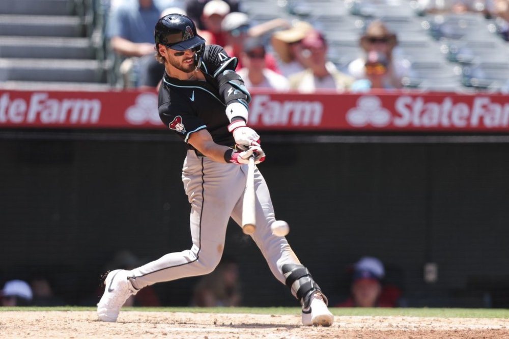 Arizona Diamondbacks' Blaze Alexander hits an RBI double during the fourth inning of a baseball game against the Los Angeles Angels in Anaheim, Calif., Sunday, July 13, 2025. (AP Photo/Jessie Alcheh)