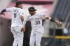 Colorado Rockies third baseman Orlando Arcia, left, and second baseman Thairo Estrada celebrate after defeating the Pittsburgh Pirates in a baseball game Saturday, Aug. 2, 2025, in Denver. (AP Photo/David Zalubowski)