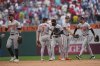 Members of the Baltimore Orioles celebrate after winning a baseball game against the Philadelphia Phillies, Wednesday, Aug. 6, 2025, in Philadelphia. (AP Photo/Matt Rourke)