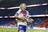 England's Chloe Kelly carries the trophy after winning the Women's Euro 2025 final soccer match between England and Spain at St. Jakob-Park in Basel, Switzerland, Sunday, July 27, 2025. (AP Photo/Alessandra Tarantino)