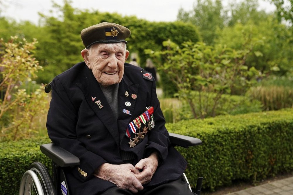 FILE - WW2 veteran Donald Rose, 110, poses for a photo at the National Memorial Arboretum, ahead of a memorial event hosted by the Royal British Legion to mark the 80th anniversary of V-E Day, in Alrewas, Staffordshire, England, Thursday, May 8, 2025. (Jacob King/PA via AP, File)