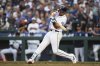 Seattle Mariners' Cal Raleigh hits a solo home run against the Milwaukee Brewers during the sixth inning of a baseball game Tuesday, July 22, 2025, in Seattle. (AP Photo/Lindsey Wasson)