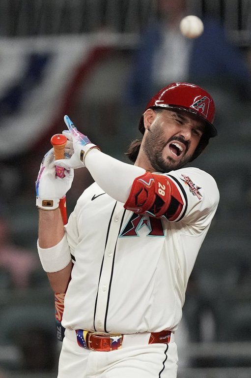 Arizona Diamondbacks' Eugenio Suárez gets hit by a pitch during eighth inning at the MLB baseball All-Star game between the American League and National League, Tuesday, July 15, 2025, in Atlanta. (AP Photo/Mike Stewart)