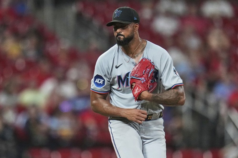 Miami Marlins starting pitcher Sandy Alcantara follows through after striking out St. Louis Cardinals' Alec Burleson with the bases loaded to end the fifth inning of a baseball game Tuesday, July 29, 2025, in St. Louis. (AP Photo/Jeff Roberson)