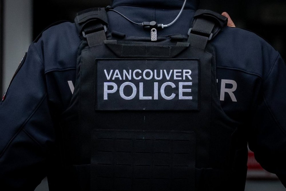 A Vancouver Police officer is pictured in Vancouver, on Wednesday, Dec. 4, 2024. Police say a 22-year-old man has been taken to hospital with life-threatening injuries from a stabbing on a bus in Vancouver. THE CANADIAN PRESS/Ethan Cairns