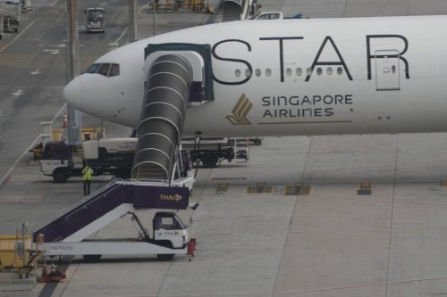 FILE - The Boeing 777-300ER aircraft of Singapore Airlines that encountered severe turbulence during a London-Singapore flight is parked at Suvarnabhumi International Airport, near Bangkok, May 22, 2024. (AP Photo/Sakchai Lalit, File)
