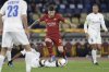 FILE - Roma's Carles Perez, center, and Gent's Elisha Owusu fight for the ball during the Europa League round of 32 first leg soccer match at Rome's Olympic stadium, Feb. 20, 2020. (AP Photo/Gregorio Borgia, File)