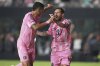 Inter Miami forward Lionel Messi, right, celebrates with Luis Suarez, left, after scoring a goal during the second half of an MLS soccer match against Nashville SC, Saturday, July 12, 2025, in Fort Lauderdale, Fla. (AP Photo/Lynne Sladky)