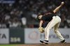 San Francisco Giants pitcher Tyler Rogers throws to a New York Mets batter during the eighth inning of a baseball game Saturday, July 26, 2025, in San Francisco. (AP Photo/Godofredo A. Vásquez)