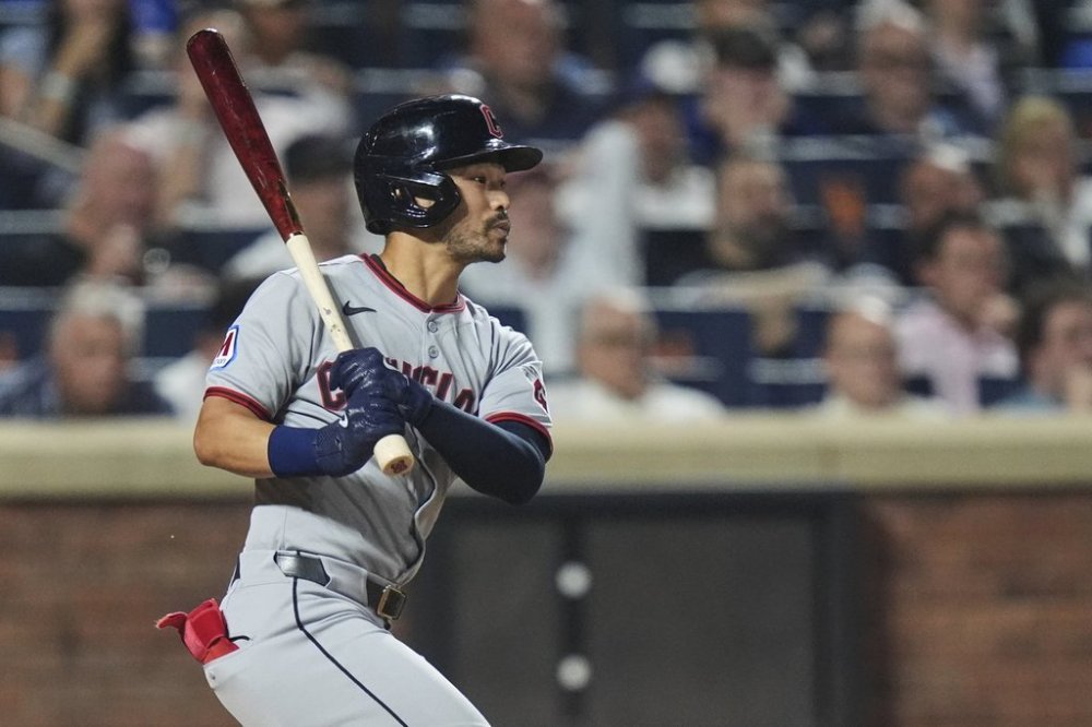 Cleveland Guardians' Steven Kwan follows through on an RBI single during the seventh inning of a baseball game against the New York Mets Tuesday, Aug. 5, 2025, in New York. (AP Photo/Frank Franklin II)