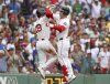 The Boston Red Sox 'Alex Bregman (right) celebrates with teammate Roman Anthony (left) after Bregman's fifth inning two run home during a baseball game against the Los Angeles Dodgers, Sunday, July 27, 2025, in Boston (AP Photo/Jim Davis).
