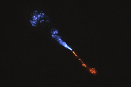 This image provided by the European Southern Observatory on Tuesday, July 15, 2025, shows jets of silicon monoxide blowing away from the baby star HOPS-315. (ALMA(ESO/NAOJ/NRAO)/M. McClure et al. via AP)