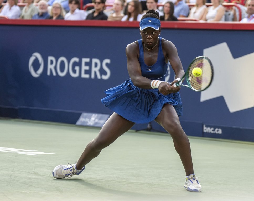 Victoria Mboko of Canada hits a return to Naomi Osaka of Japan during finals tennis action at the National Bank Open in Montreal, Thursday, Aug. 7, 2025. THE CANADIAN PRESS/Christinne Muschi