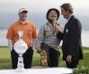 FILE - Actor Bill Murray, center, jokes with announcer Ian Baker-Finch, right, on the 18th green about his shoes as D.A. Points, left, looks on during the trophy presentation of the AT&T Pebble Beach National Pro-Am golf tournament in Pebble Beach, Calif., Sunday, Feb. 13, 2011. (AP Photo/Eric Risberg, File)