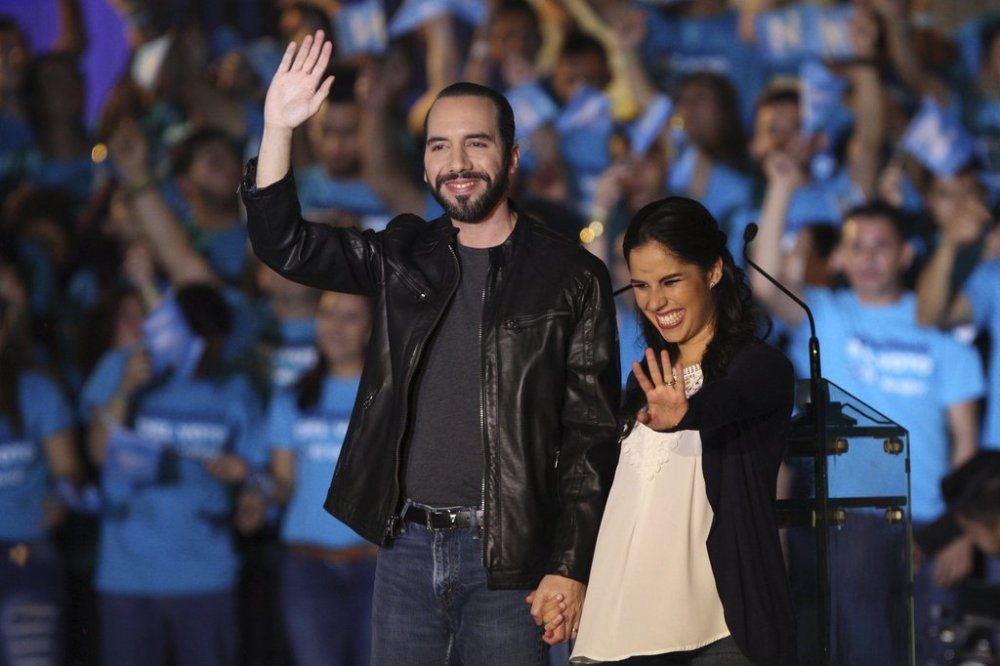 FILE - Nayib Bukele, presidential candidate for the Gran Alianza por la Unidad Nacional, GANA, left, holds a campaign rally with his wife Gabriela Rodriguez in San Salvador, El Salvador, Jan. 26, 2019, ahead of the Feb. 3 vote. (AP Photo Salvador Melendez, File)