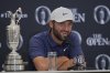 Scottie Scheffler of the United States speak at a press conference after winning the British Open golf championship at the Royal Portrush Golf Club, Northern Ireland, Sunday, July 20, 2025. (AP Photo/Jon Super)