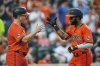 Baltimore Orioles' Cedric Mullins, right, celebrates with Tyler O'Neill, left, after hitting a three-run home run during the fourth inning of a baseball game against the Colorado Rockies, Saturday, July 26, 2025, in Baltimore. (AP Photo/Stephanie Scarbrough)