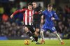 FILE - Brentford's Christian Norgaard, left, defends the ball from Chelsea's Cole Palmer during the English Premier League soccer match between Chelsea and Brentford at Stamford Bridge in London, Dec. 15, 2024. (AP Photo/Kin Cheung, File)