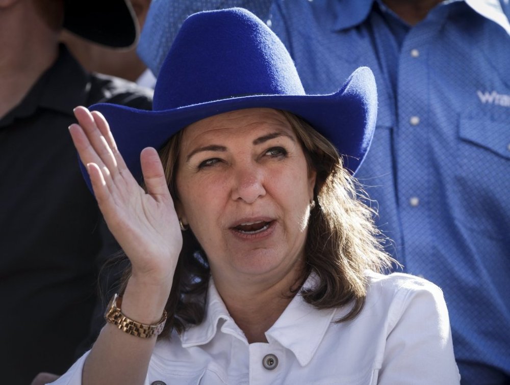Alberta Premier Danielle Smith waves from a float during the Calgary Stampede parade in Calgary, Alta., Friday, July 4, 2025. THE CANADIAN PRESS/Jeff McIntosh