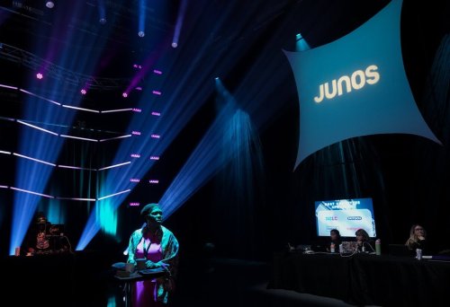 A woman waits for the Juno Awards nominees announcement to start in Toronto on Tuesday, Feb. 6, 2024. THE CANADIAN PRESS/Nathan Denette