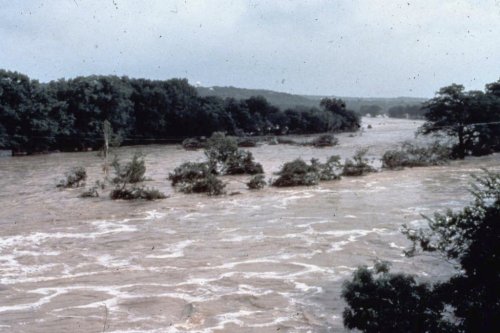 This photo provided by the National Weather Service shows flooding in the Guadalupe River in Texas on July 17, 1987. (NWS via AP)