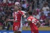 Bayern Munich's Thomas Muller, left, battles for the ball with Auckland City's Gerard Garriga during the Club World Cup group C soccer match between Bayern Munich and Auckland City in Cincinnati, Sunday, June 15, 2025. (AP Photo/Joshua A. Bickel)